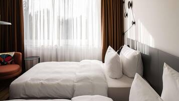 Roba de llit hipoal·lergògena i caixa forta a l'habitació