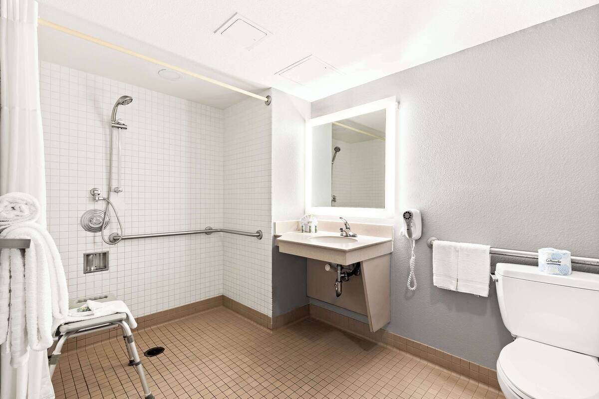standard room, 2 queen beds, accessible, non smoking | bathroom | combined shower/bathtub, free toiletries, hair dryer, towels