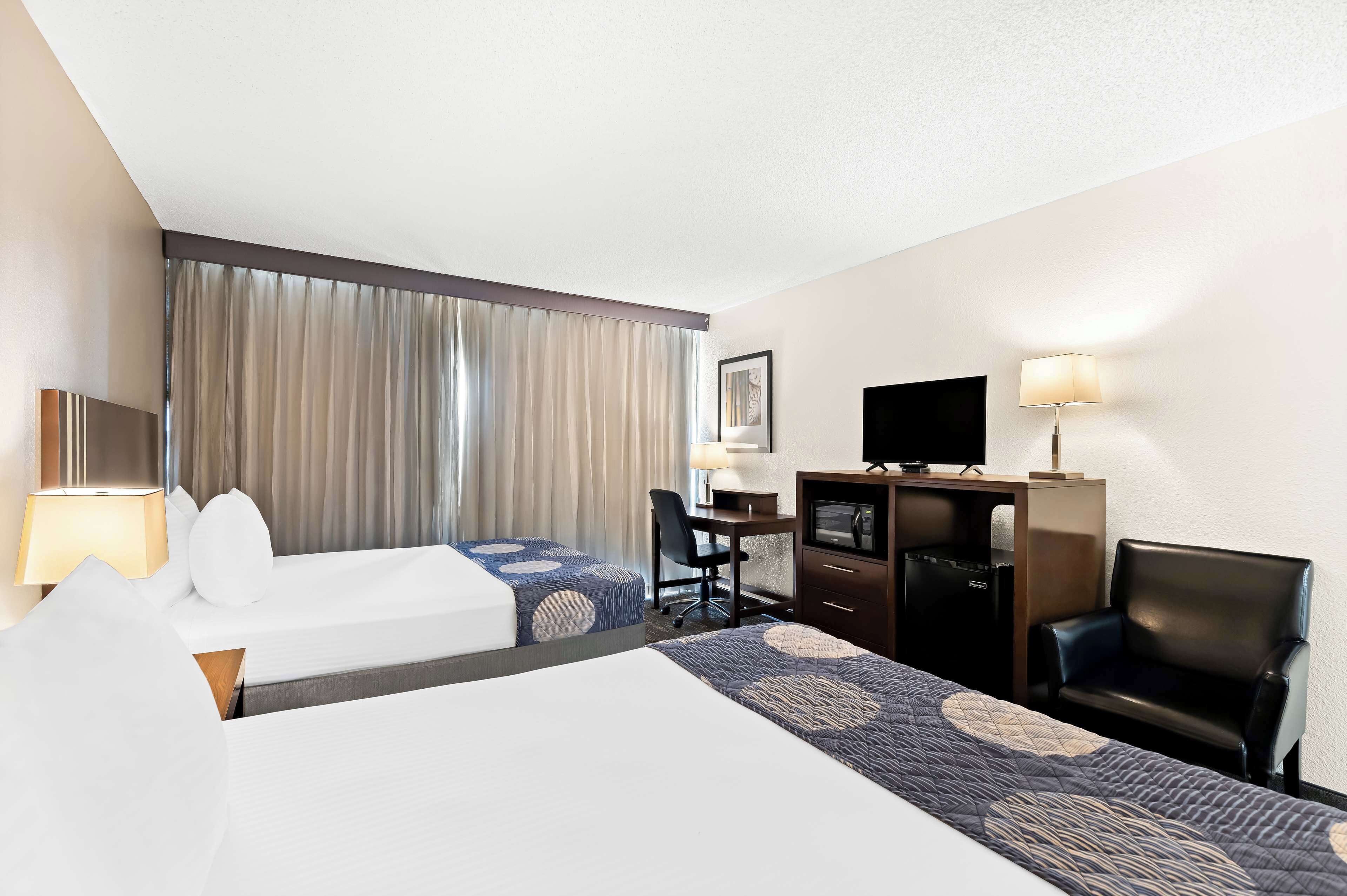 desk, blackout curtains, iron/ironing board, cots/infant beds