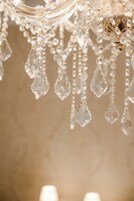 A chandelier with multiple crystal elements.