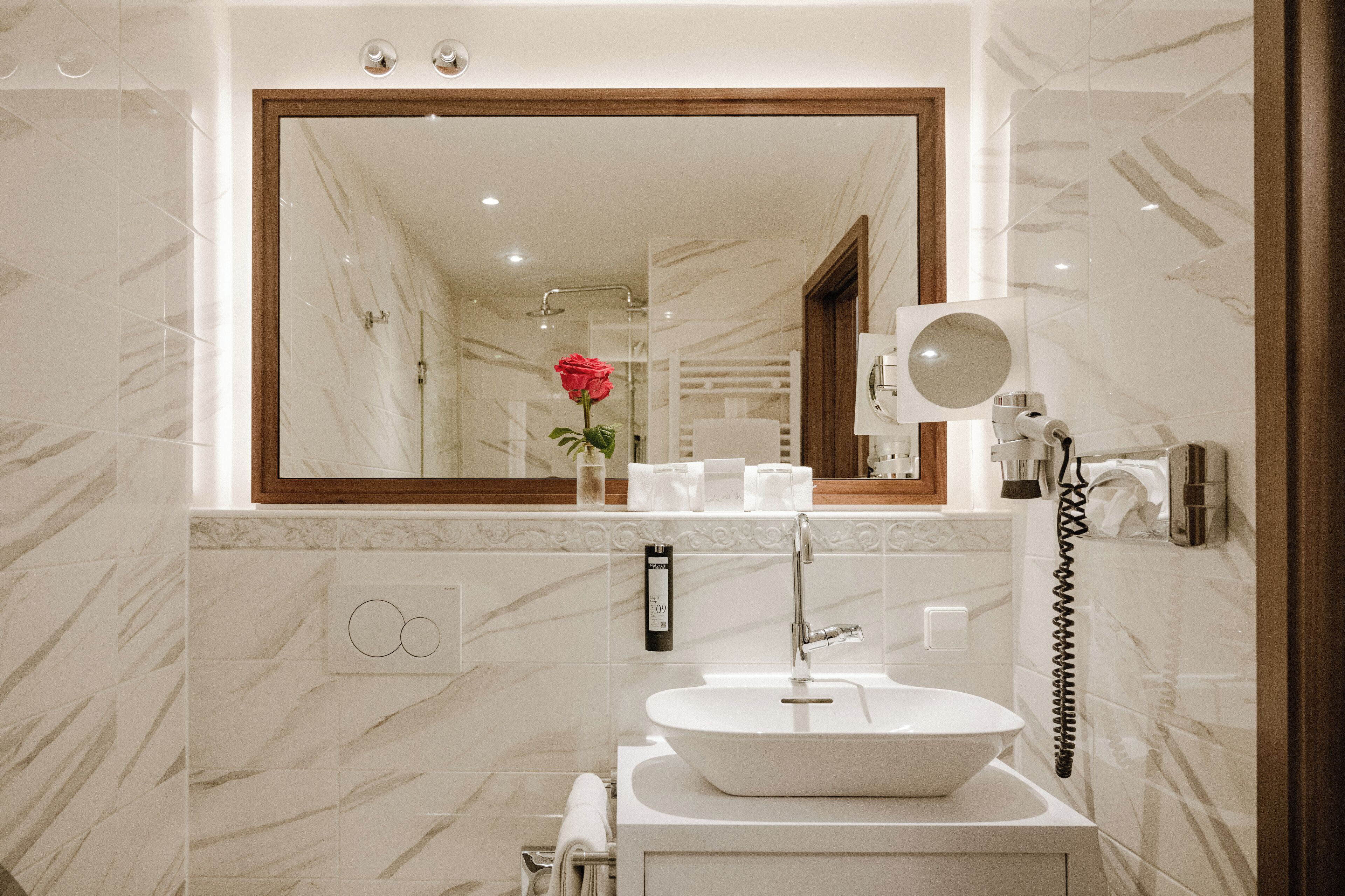 eco-friendly toiletries, hair dryer, towels