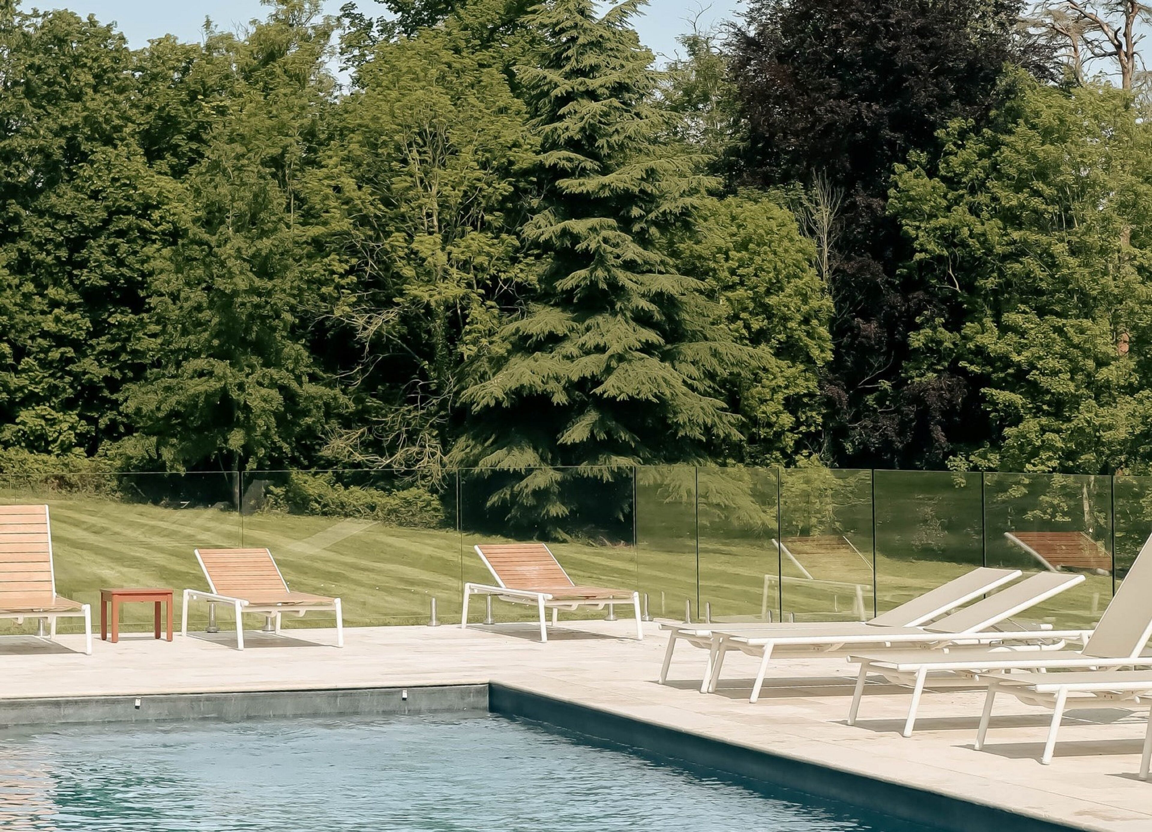 indoor pool, seasonal outdoor pool, pool umbrellas, pool loungers