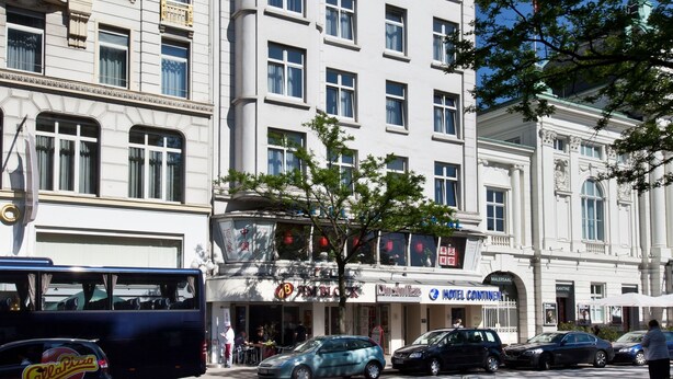 A multi-story hotel with a prominent "Continental" sign.