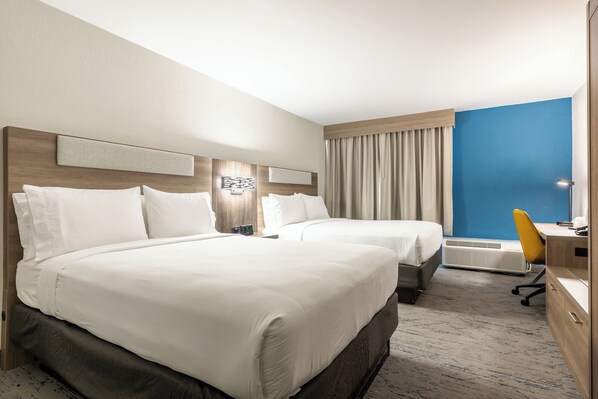 A hotel room with two beds, a desk, a chair, and a large window with curtains. - Holiday Inn Express Van Nuys by IHG (Van Nuys)