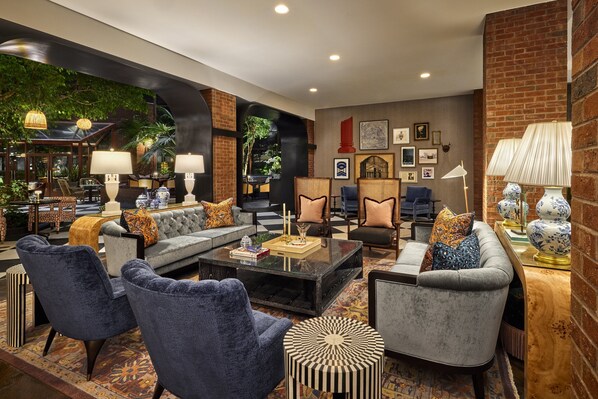 Relax in a comfortable lounge area with sofas, armchairs, and coffee tables.