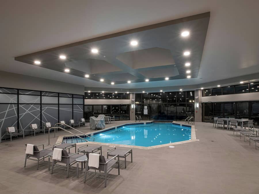 Indoor pool, outdoor pool, open 6 AM to 11 PM, pool umbrellas