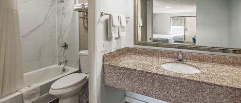 Combined shower/tub, hydromassage showerhead, towels, soap