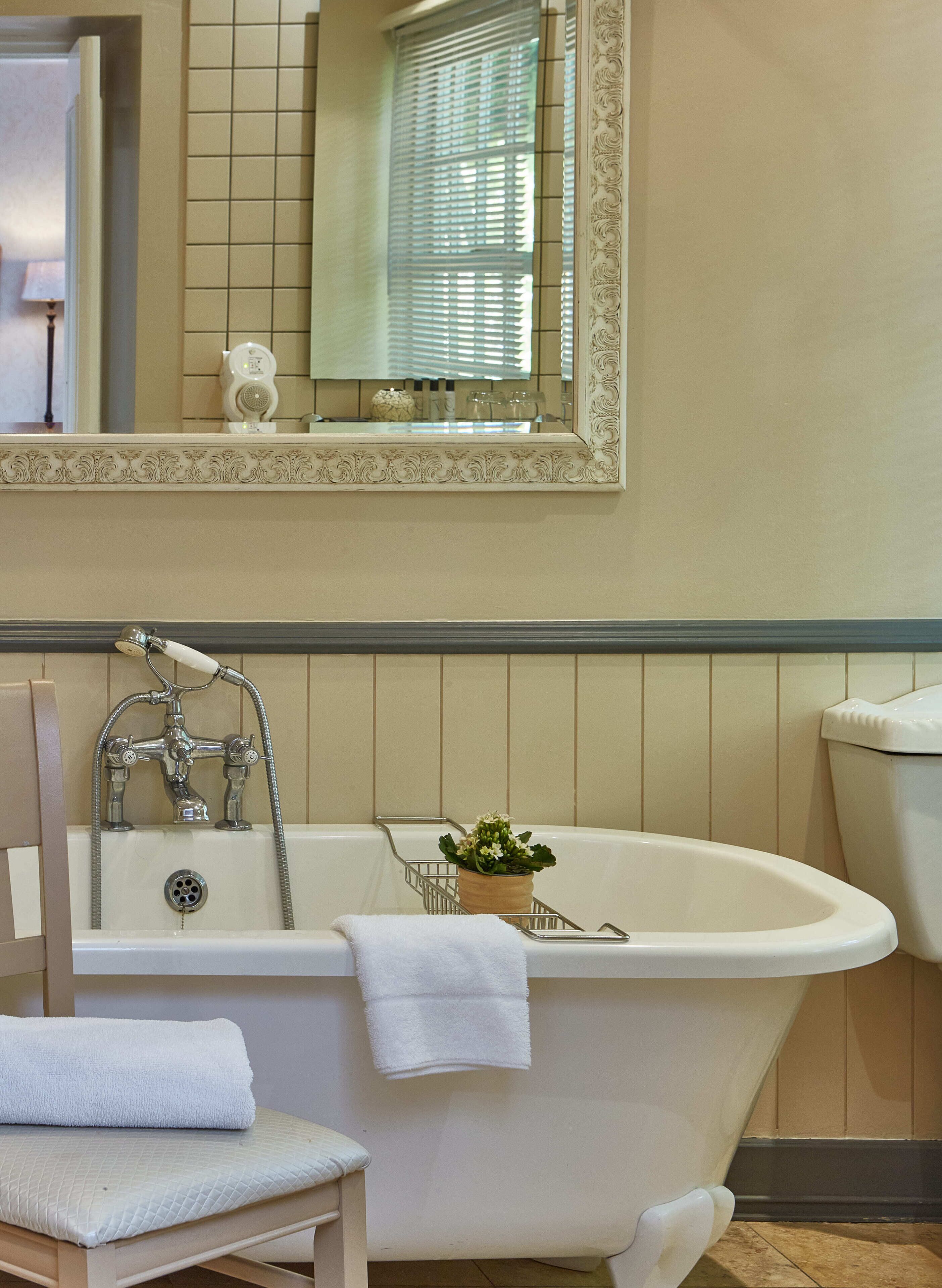 separate bathtub and shower, deep-soaking bathtub, rainfall showerhead