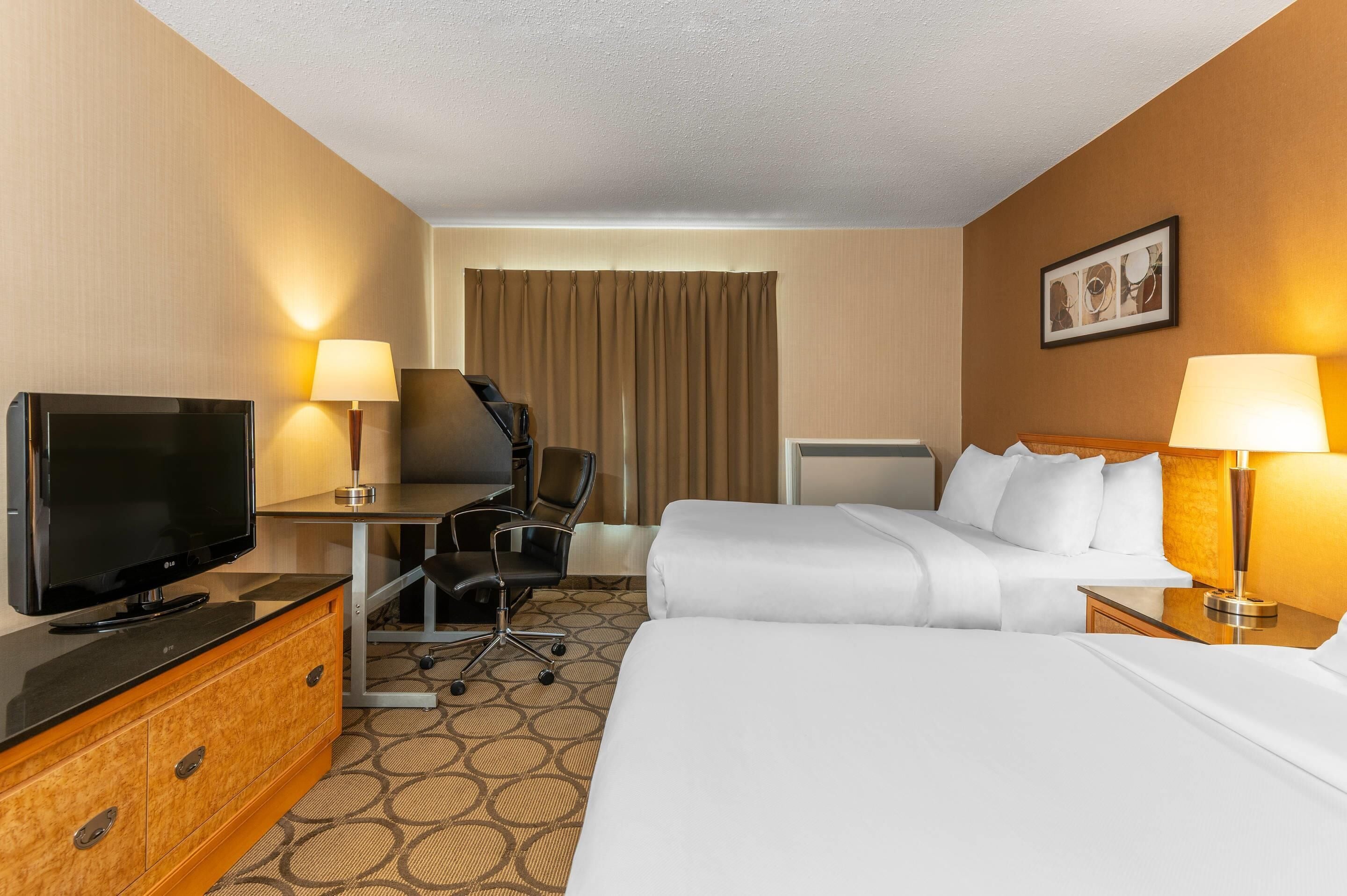 Premium bedding, pillowtop beds, desk, blackout drapes