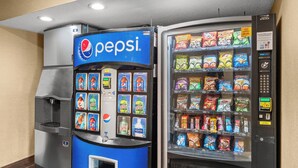 A vending machine with Pepsi branding and a snack vending machine. - Red Roof Inn Lansing East – MSU (Lansing)