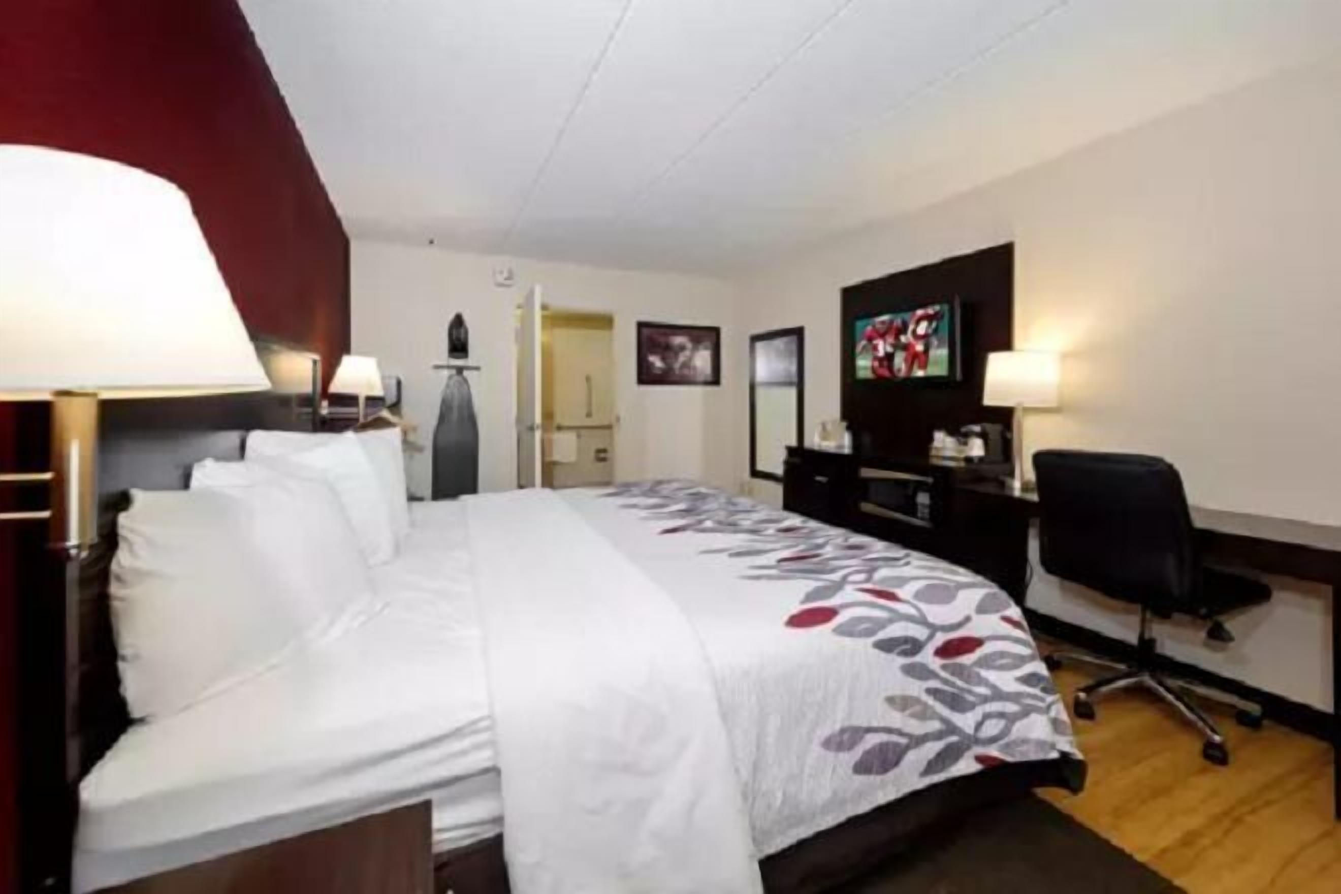 Desk, blackout drapes, iron/ironing board, free cribs/infant beds