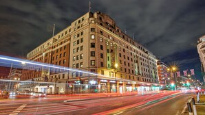 A large, historic building with multiple floors and a prominent corner entrance. - The Cumberland, London (London)