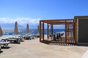 Private beach, beach umbrellas, beach towels, scuba diving