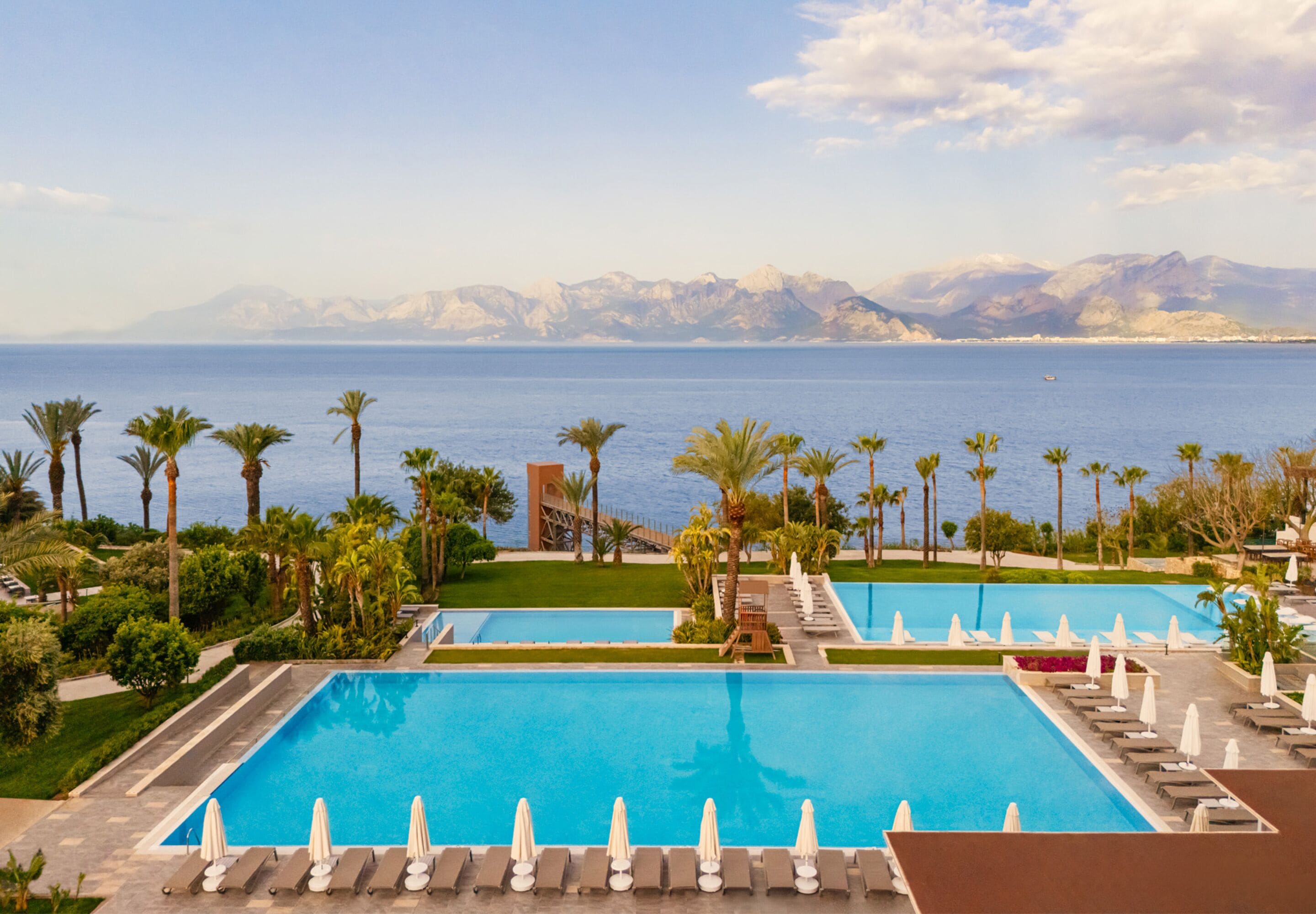 indoor pool, seasonal outdoor pool, pool umbrellas, pool loungers