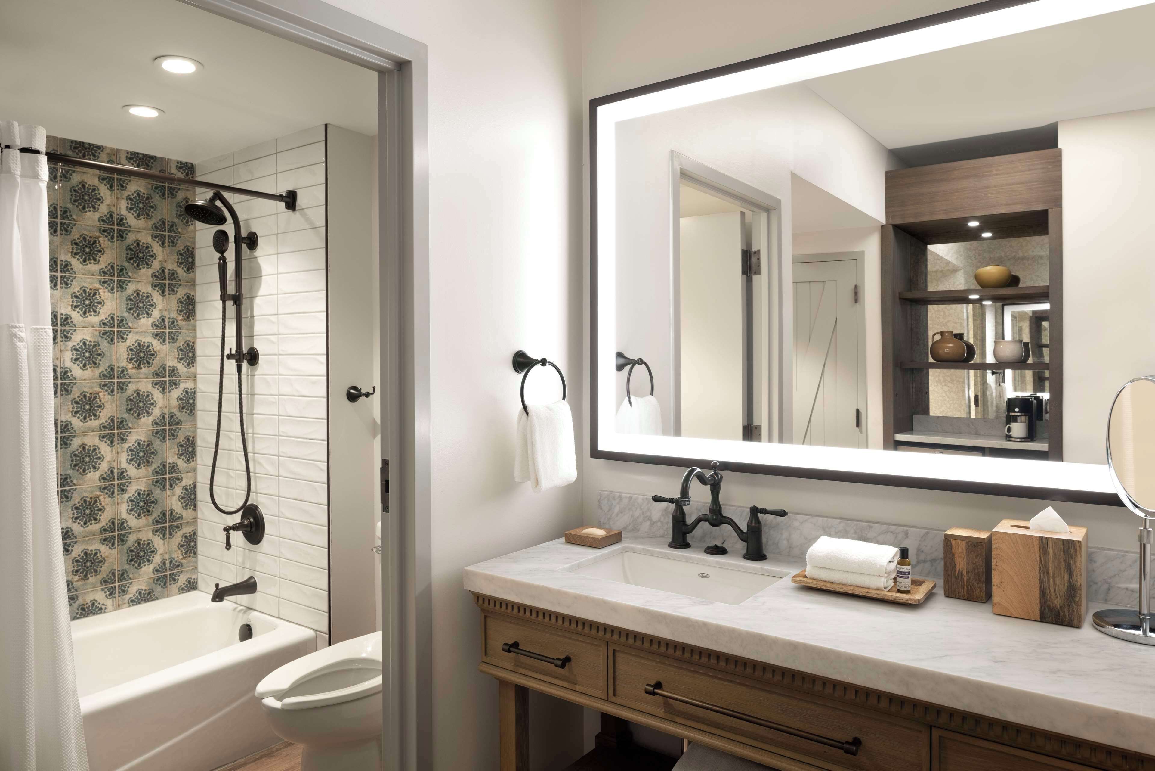 designer toiletries, hair dryer, towels