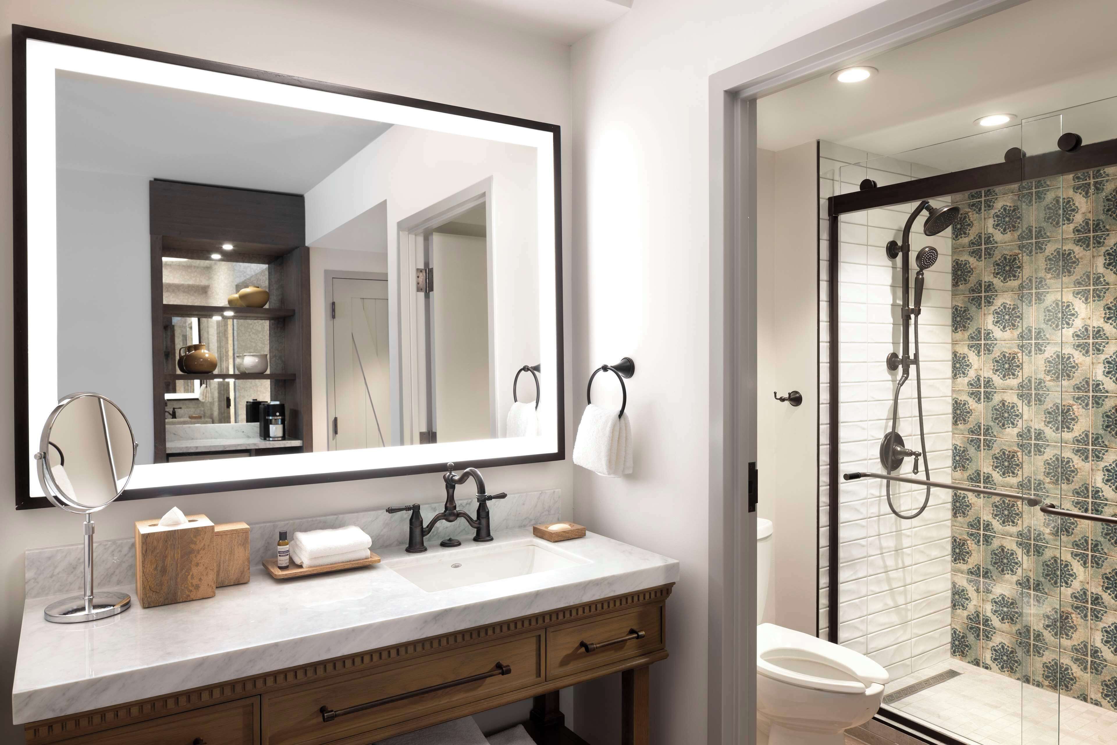 designer toiletries, hair dryer, towels