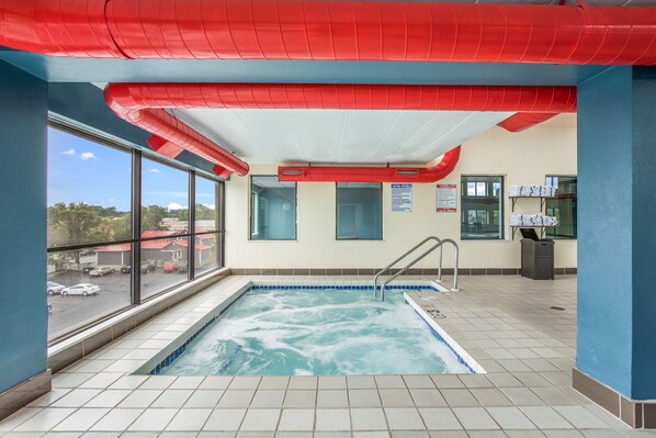 Swimmers can enjoy a clear view of the surroundings from this indoor pool area.