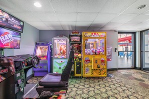 Enjoy a variety of games in our arcade, featuring racing, claw, and taxi games.