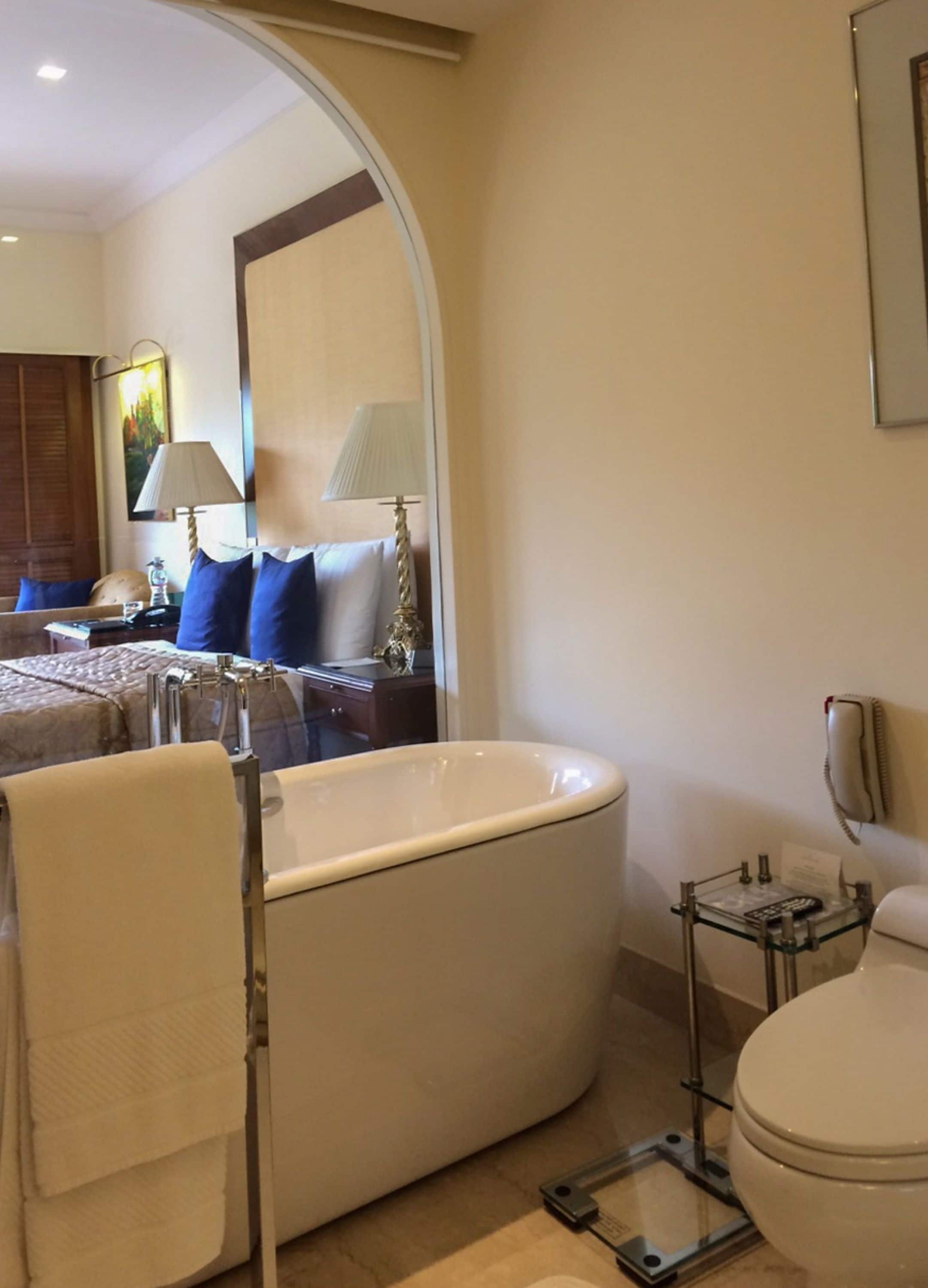 separate bathtub and shower, deep-soaking bathtub, rainfall showerhead