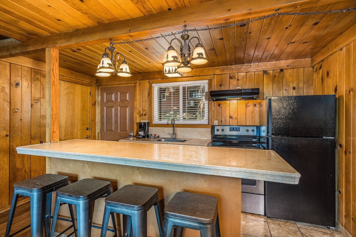 microwave, coffee/tea maker, cleaning supplies, freezer