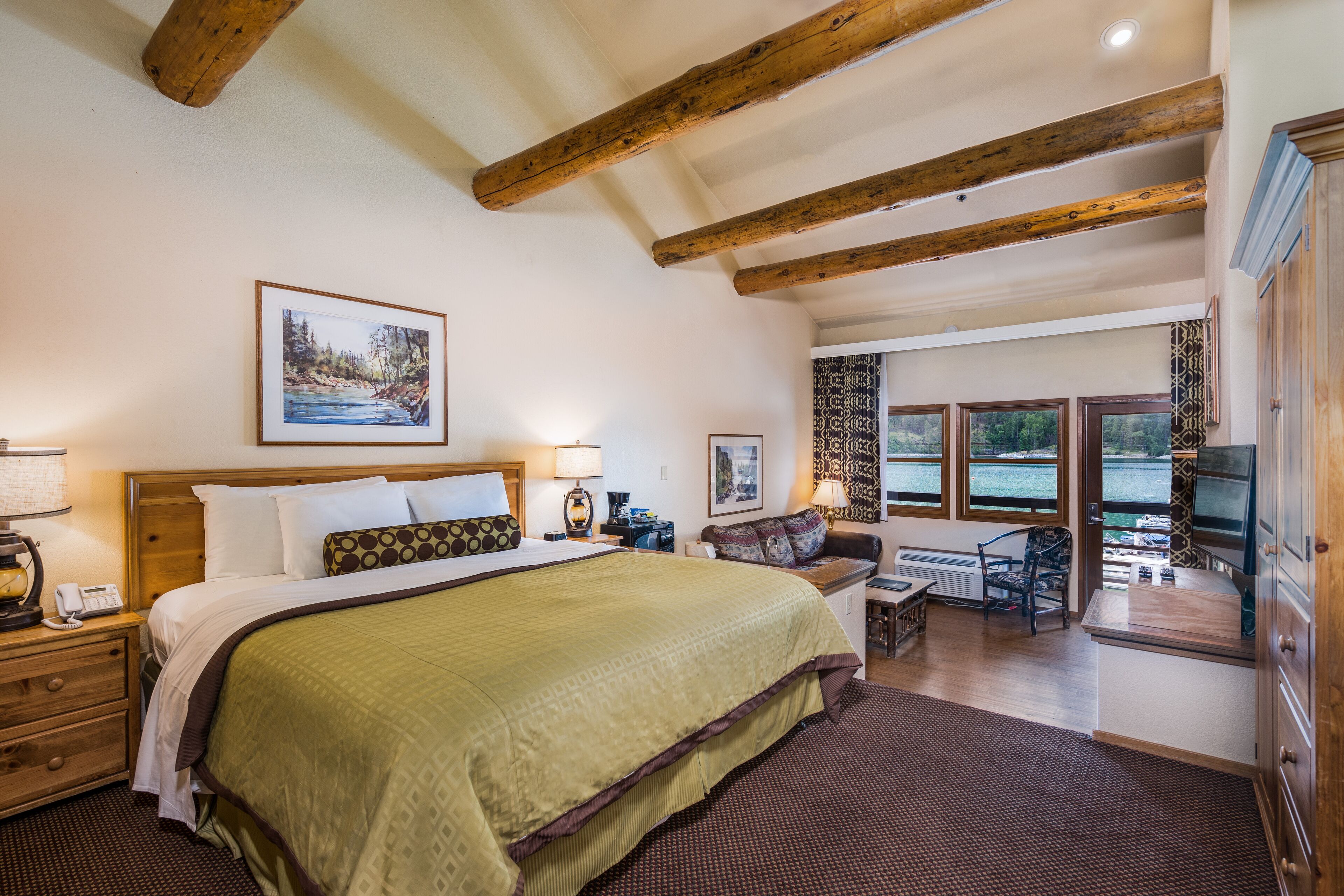 deluxe suite, 1 king bed with sofa bed, jetted tub, lake view | 1 bedroom, desk, blackout curtains, iron/ironing board