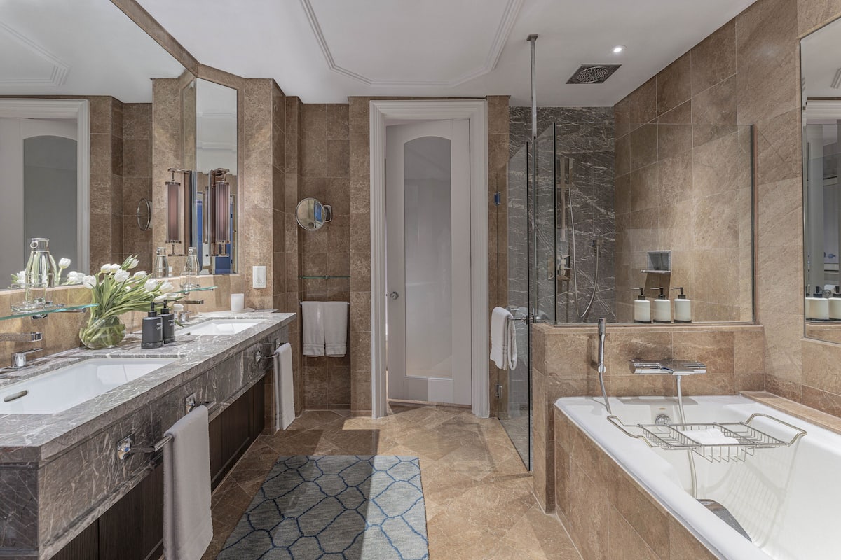 separate bathtub and shower, deep-soaking bathtub, rainfall showerhead