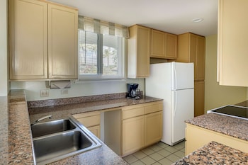 Full-size fridge, microwave, stovetop, dishwasher at Hilton Vacation Club The Point At Poipu Kauai