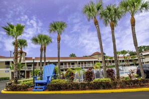 Relax in style with a balcony overlooking lush surroundings.