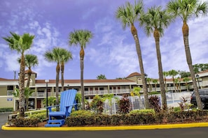 Relax in style with a balcony overlooking lush surroundings.