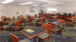 Relax in this inviting space with a dining area, kitchenette, and large window.