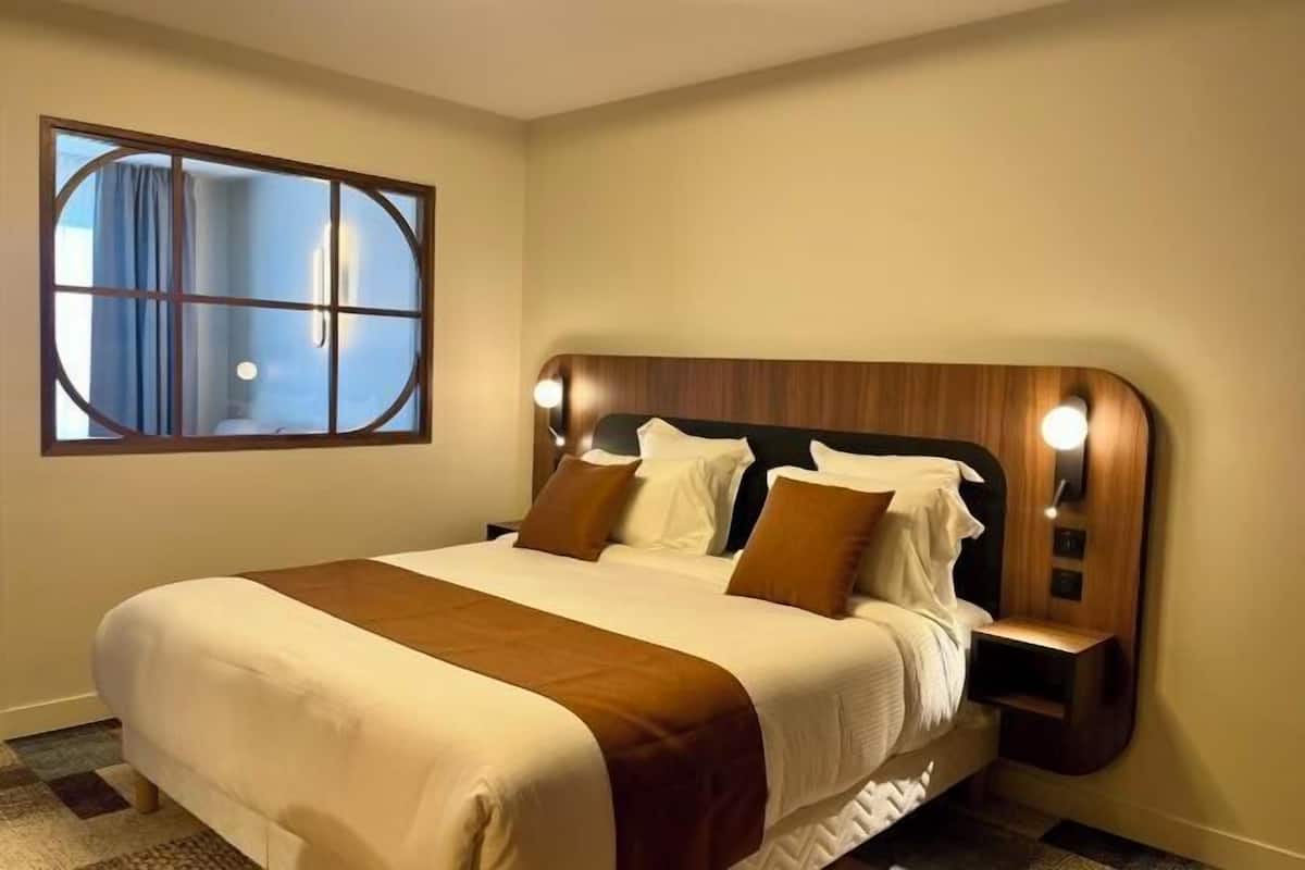 Premium bedding, pillow-top beds, desk, laptop workspace