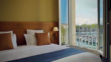 Premium bedding, pillow-top beds, desk, laptop workspace