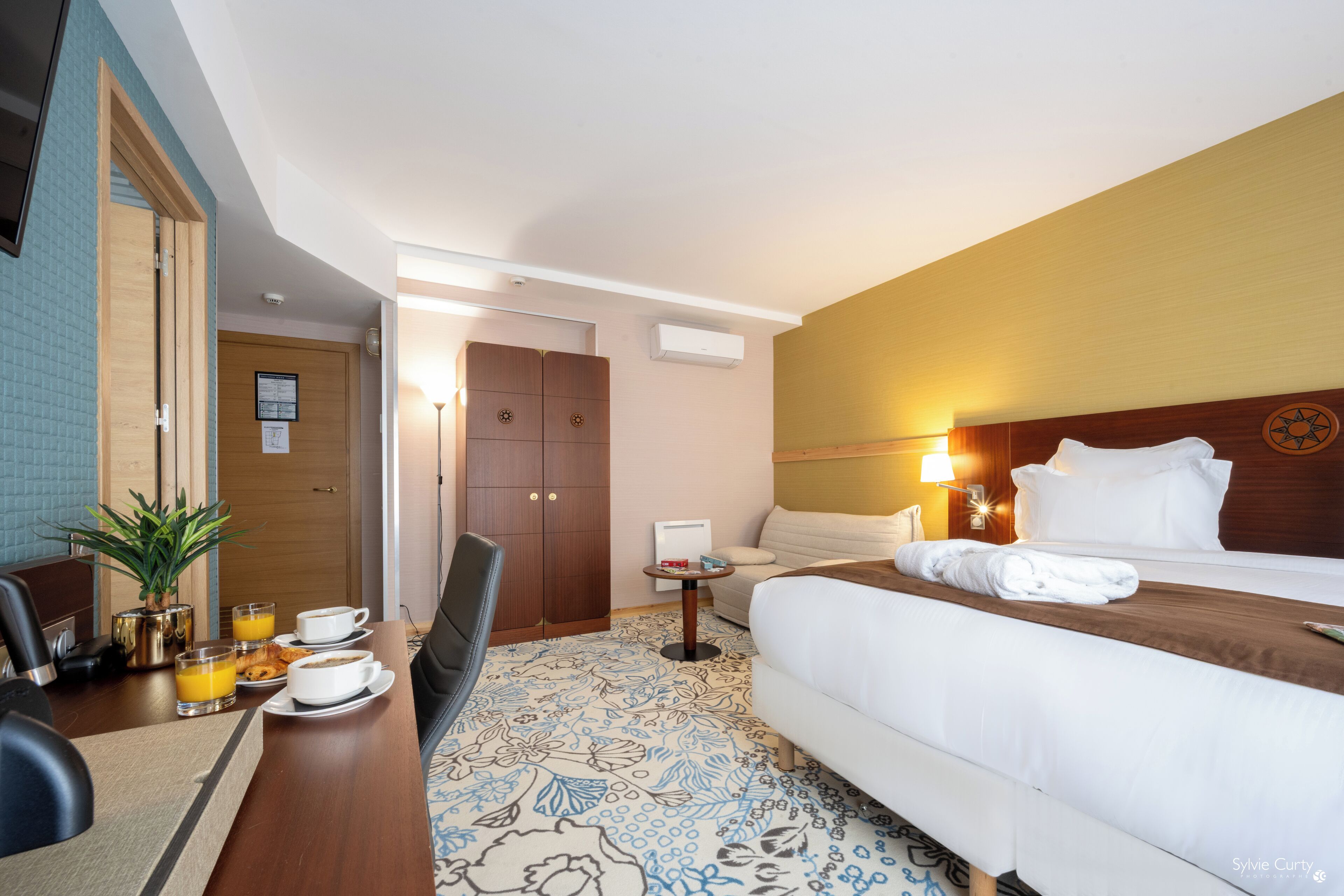 Premium bedding, pillow-top beds, desk, laptop workspace