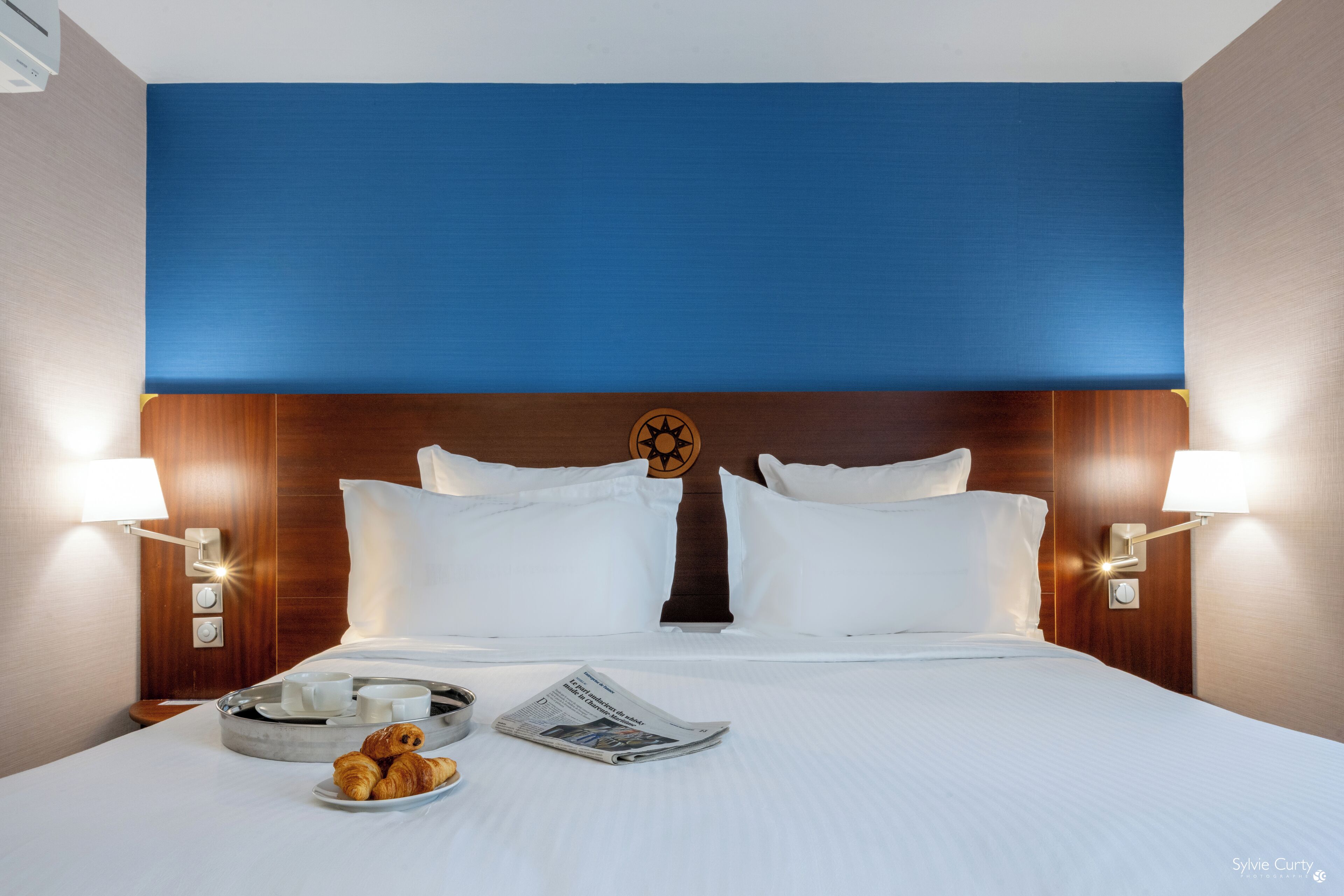 Premium bedding, pillow-top beds, desk, laptop workspace