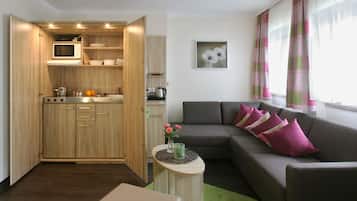 Suite Deluxe, 1 cama de matrimonio grande | Zona de estar