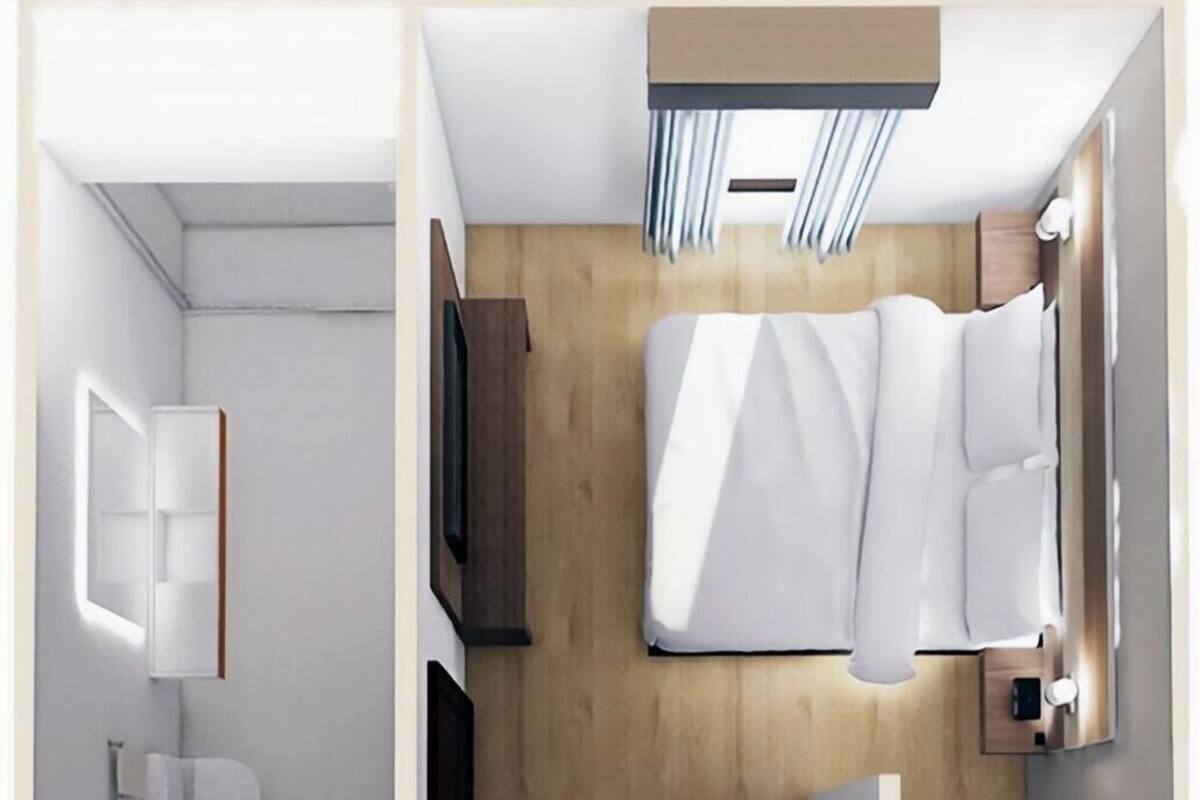 Un apartamento de dos pisos, con un dormitorio en el nivel superior y una sala de estar en el inferior.