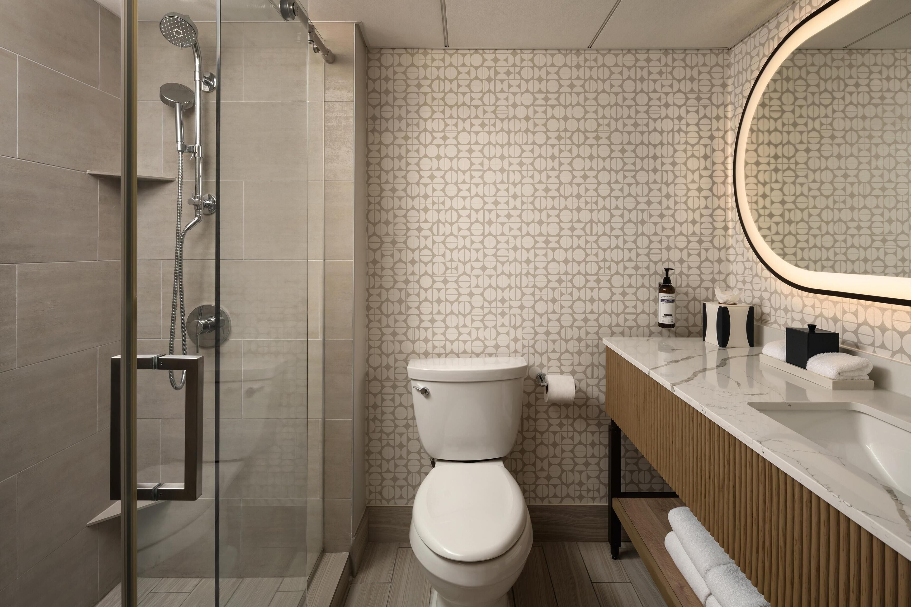 shower, designer toiletries, hair dryer, towels