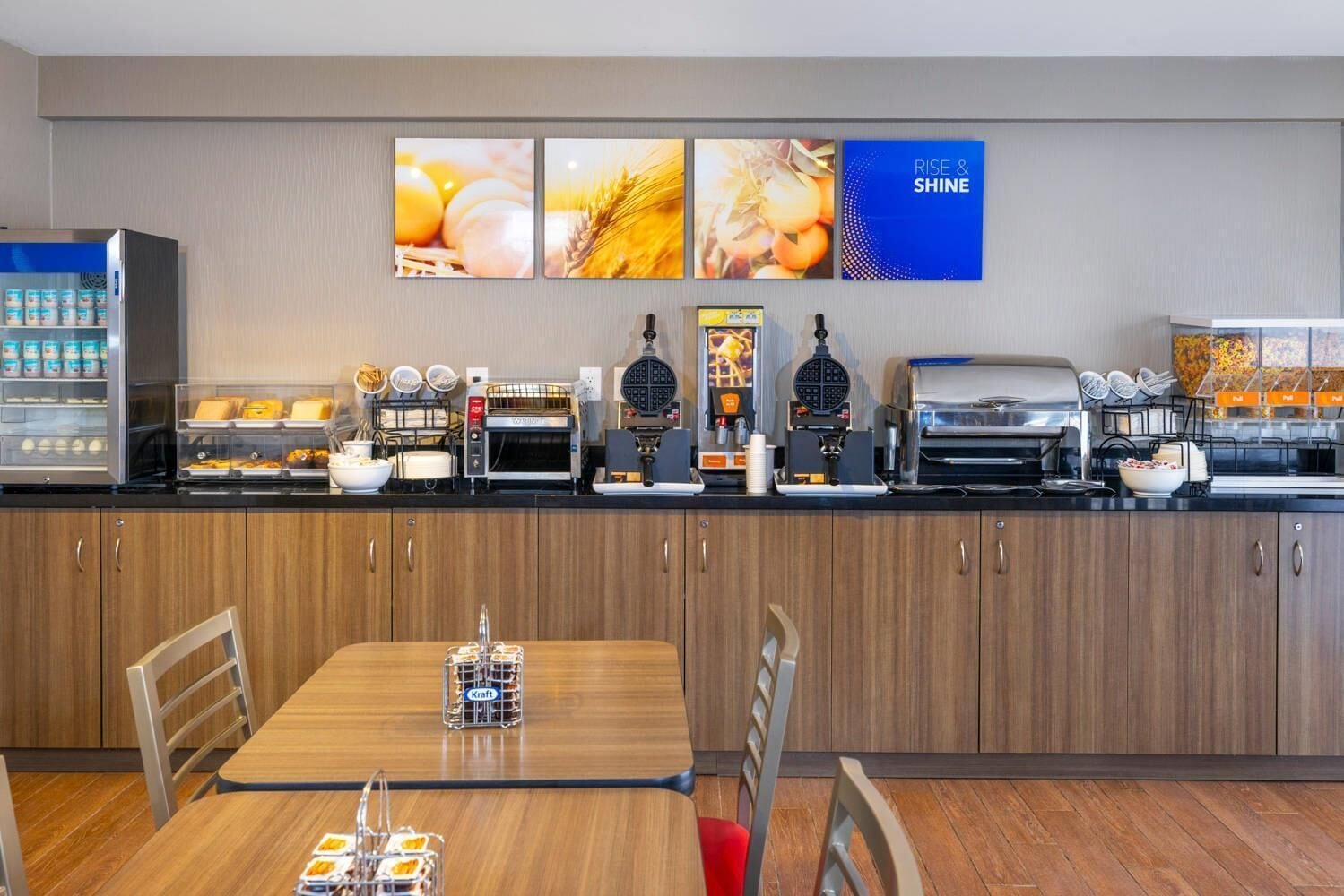 A breakfast bar with various food items and a coffee station.