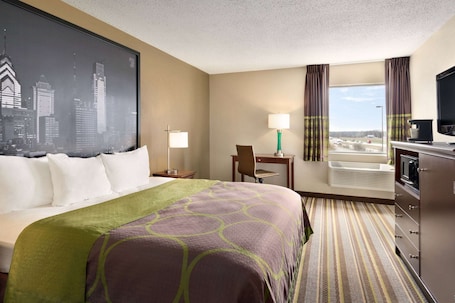 Desk, laptop workspace, iron/ironing board, free cribs/infant beds