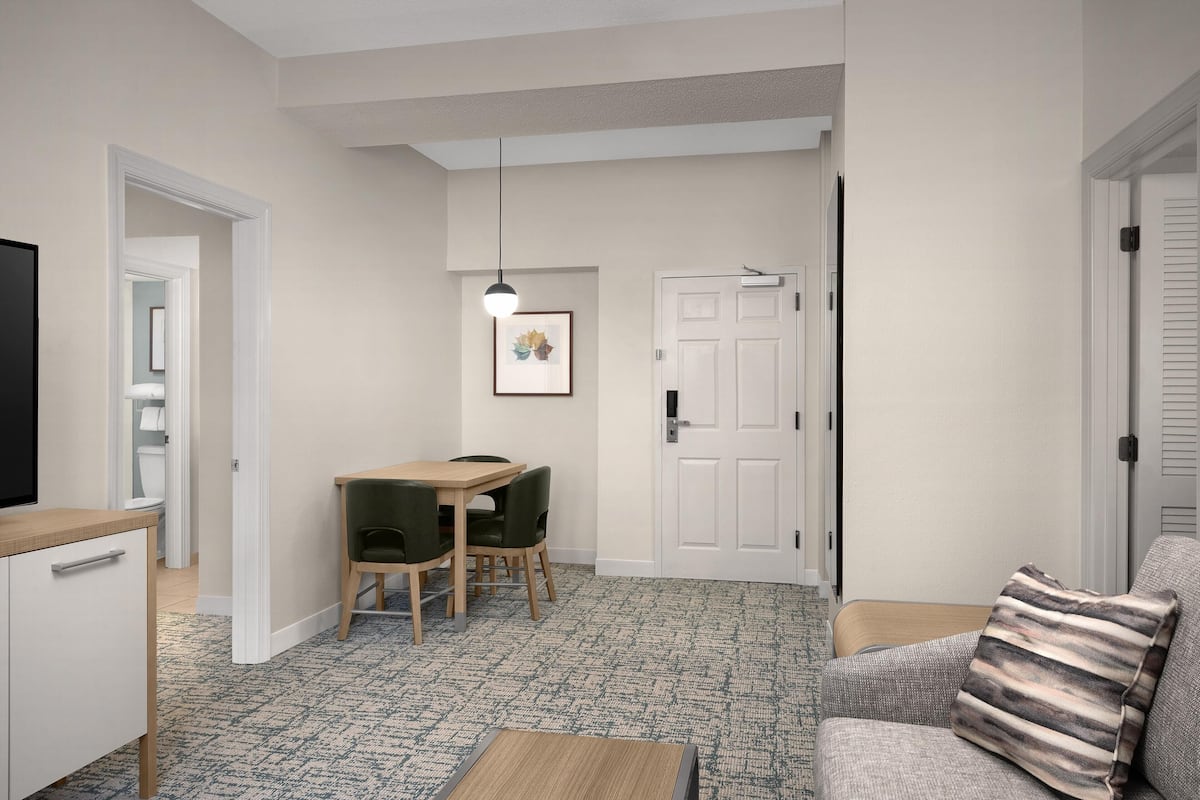 Two Bedroom Suite, 1 Queen and 2 Double Beds, Non-Smoking | Living area | 42-inch LCD TV with premium channels, TV, pay movies