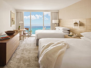 In-room safe, laptop workspace, blackout drapes, soundproofing at Alohilani Resort Waikiki Beach