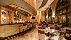 A spacious hotel lobby with a marble reception desk, multiple seating areas, and large windows. - DoubleTree by Hilton Hotel Toronto Downtown (Toronto)