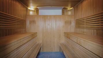 A sauna with wooden benches and a tiled floor.