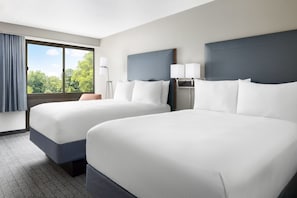 Premium bedding, pillow-top beds, desk, laptop workspace