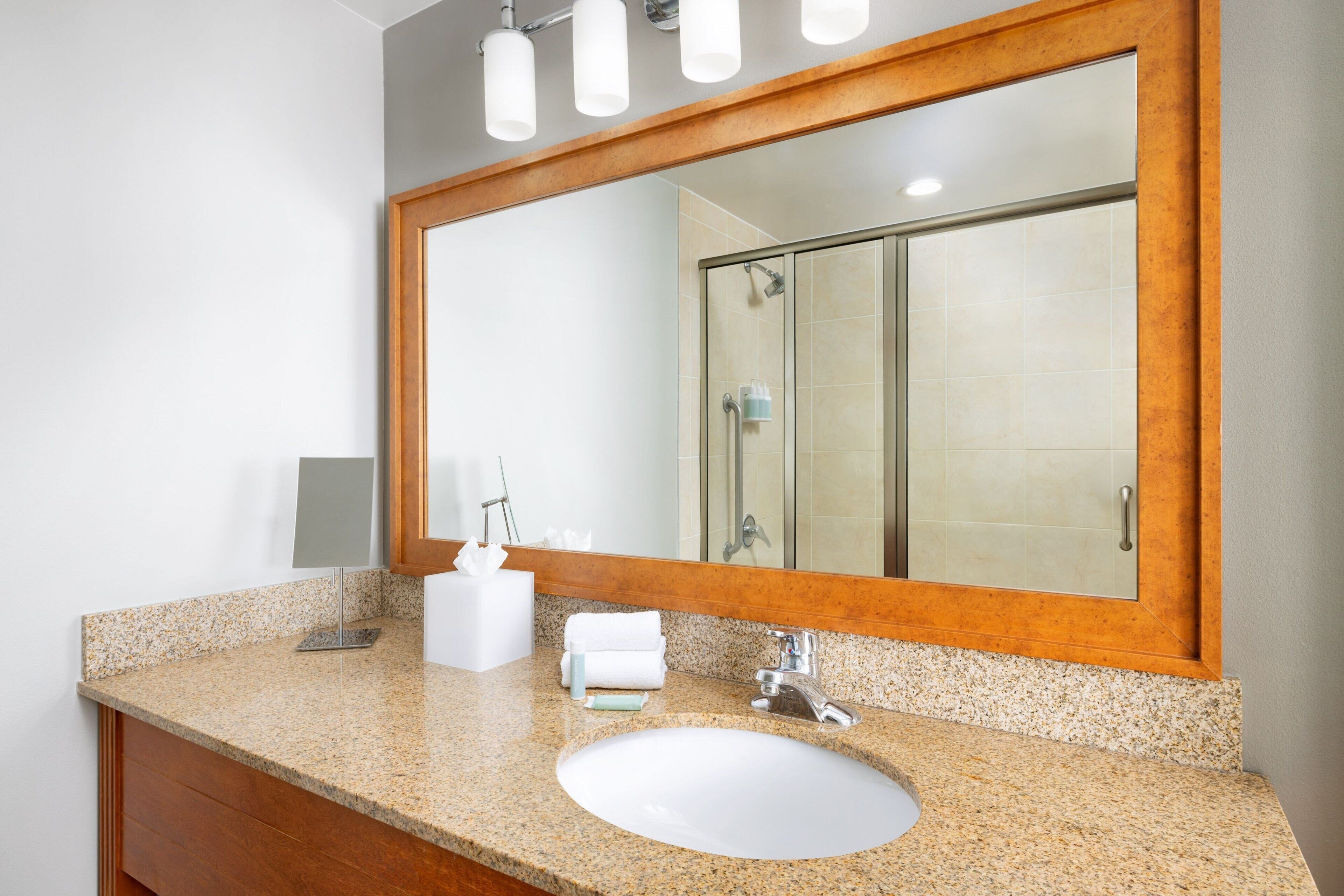 designer toiletries, hair dryer, towels