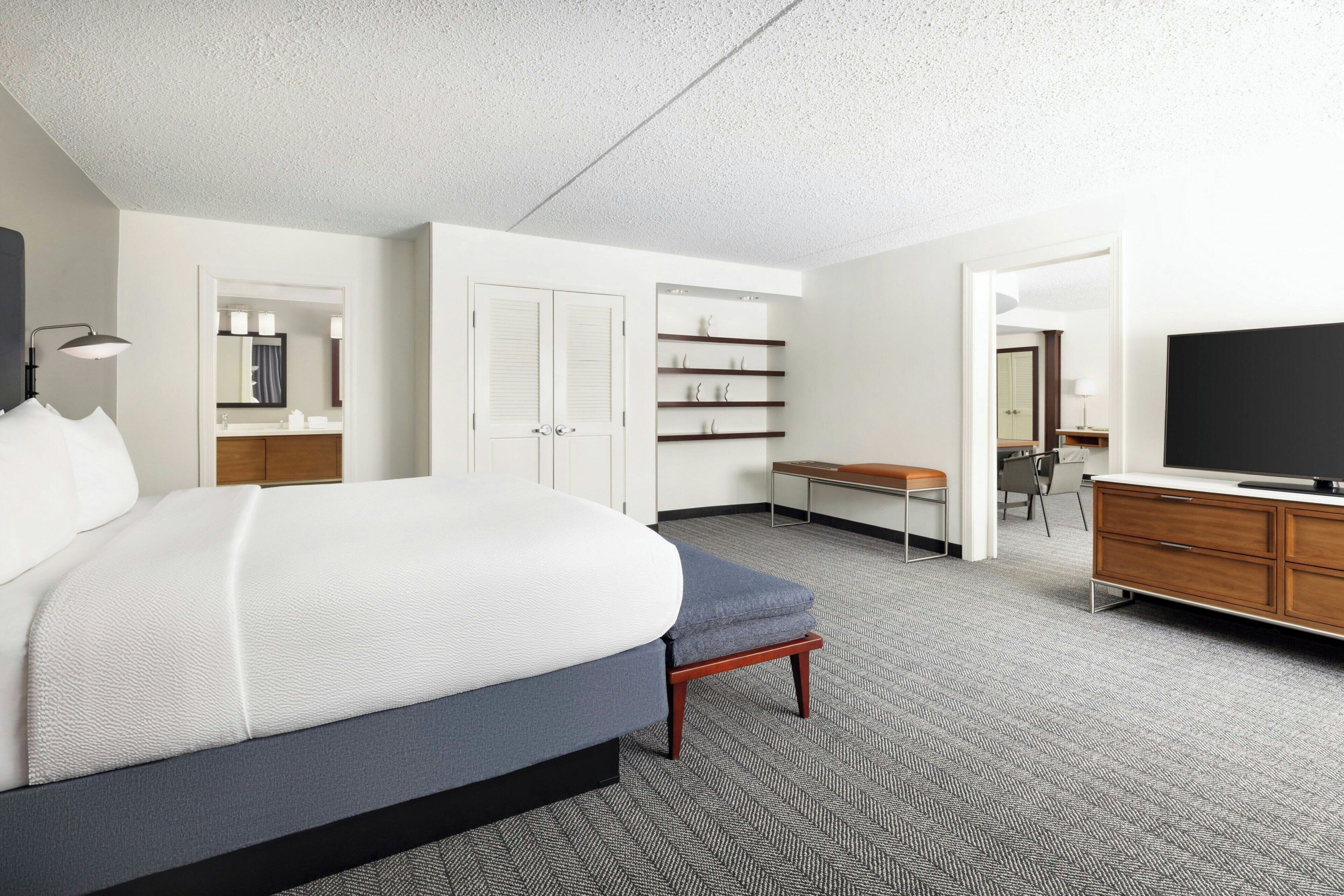 Premium bedding, pillow-top beds, desk, laptop workspace