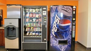 A vending machine with a Pepsi logo, a water dispenser, and a refrigerator. - Willow Lodge Willoughby – Cleveland Mentor (Willoughby)