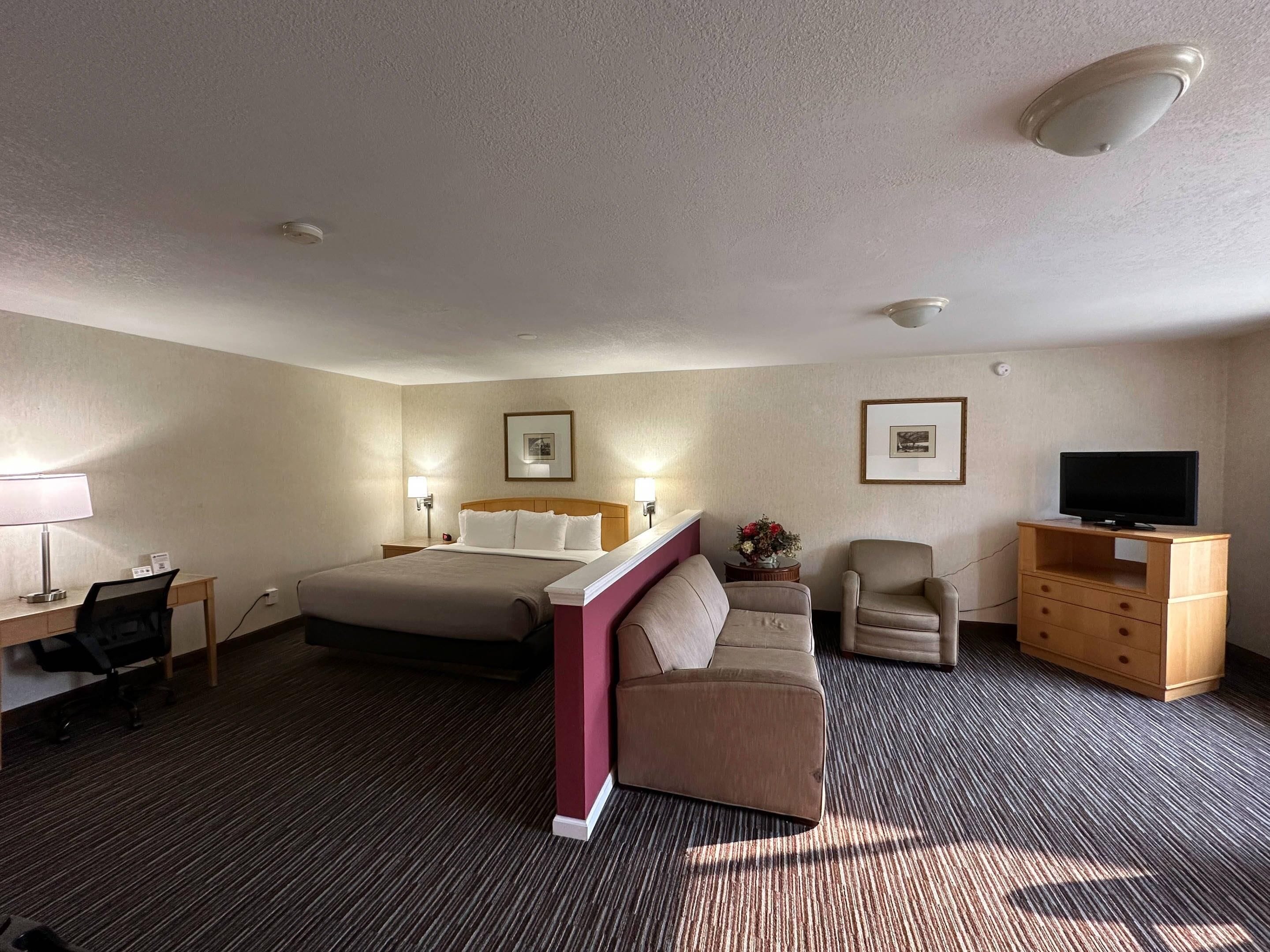 premium bedding, desk, blackout curtains, iron/ironing board