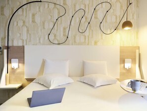 Premium bedding, blackout drapes, soundproofing, iron/ironing board