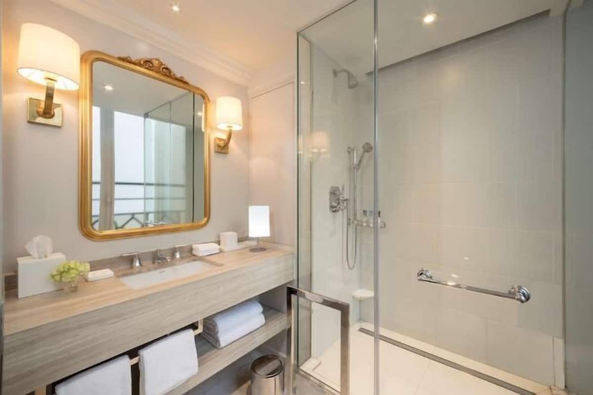Bathroom | Rainfall showerhead, designer toiletries, hair dryer, bathrobes